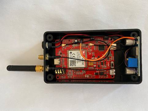 A black box with red and black electronics

Description automatically generated