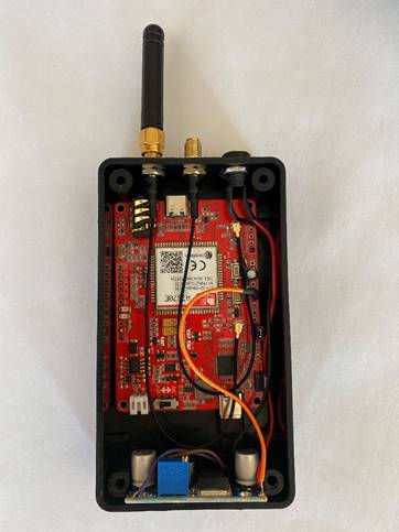 A black box with red and black electronics

Description automatically generated